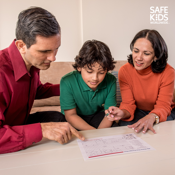 A Family sits down to go over their home escape plan