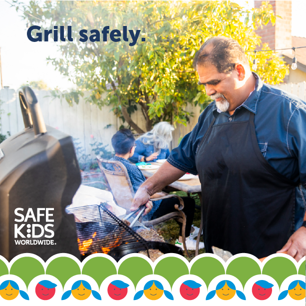 Dad grilling in the backyard