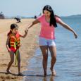 A mother and daughter at the beach.