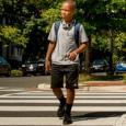 A teen crossing the street.