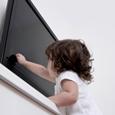 Child tipping over an unsecured TV