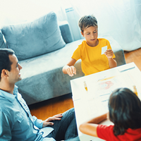 Family playing board game