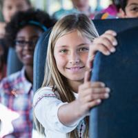 A school bus filled with kids.