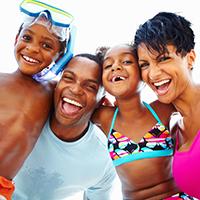 A smiling family taking a family picture. 