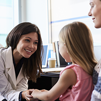 ASK AN EXPERT: Keeping Medicine Up and Away Medical professional talking to mom and kid