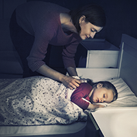 Become a CO Pro with these 3 steps little girl sleeping in bed while mom tucks her in