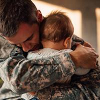 Military Families A father hugs his child.