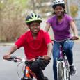 Mother and son take a ride on their bikes.