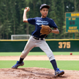 Boy playing Baseball during Sports Safety Month