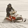 Rider wearing proper snow mobile safety gear