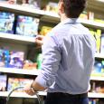 Father looking at toys to buy for kids