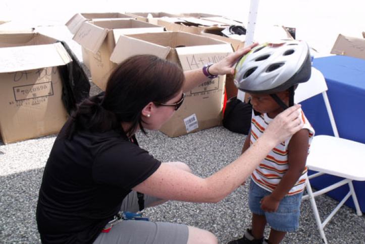 Getting fitted for a bike helmet.