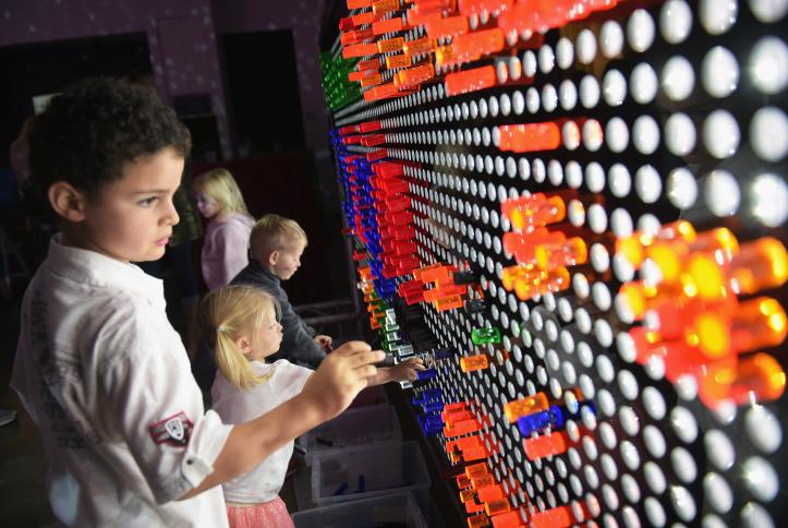 Kids enjoying the giant lite brite at Safe Kids Day 2016