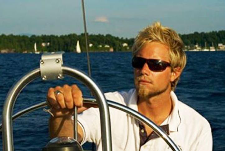 Ben Haller steering his boat out to sea.