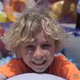 Boy playing in ball pit at Safe Kids Day