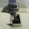 A tether lock on the top rearseat shelf of a car